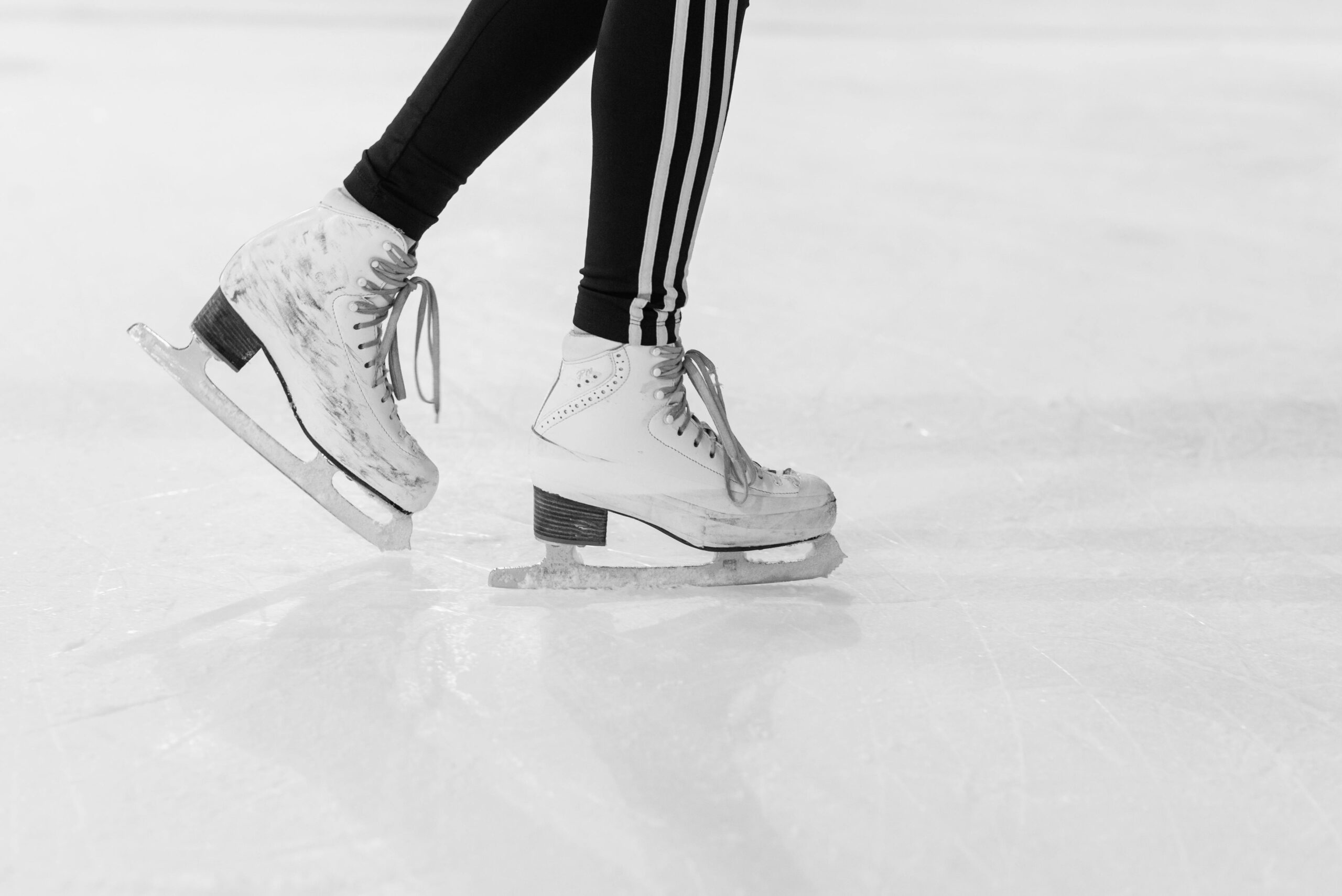 Ice skating boots on an ice rink for summer boarding courses in the UK.